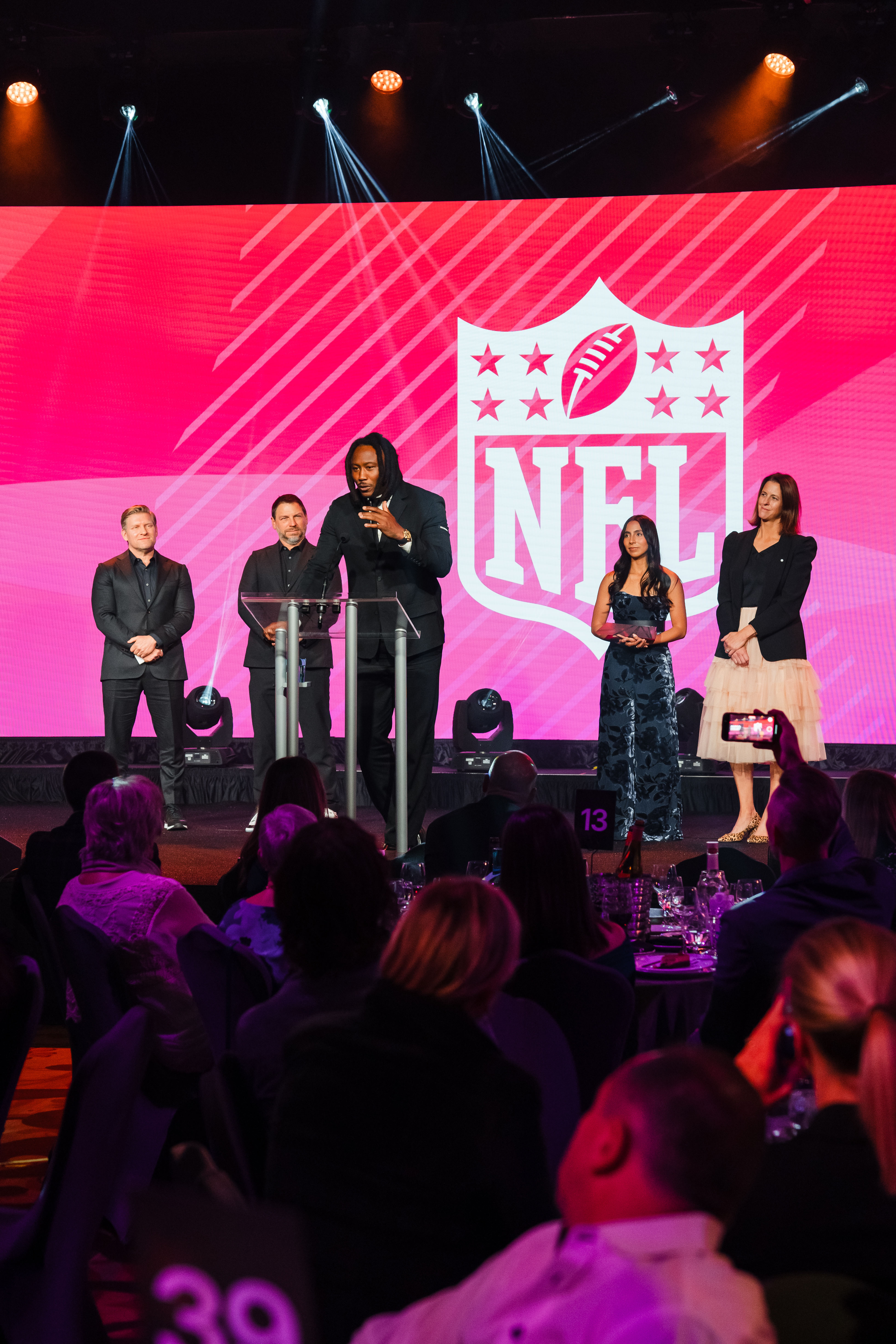 NFL speaker addressing an audience